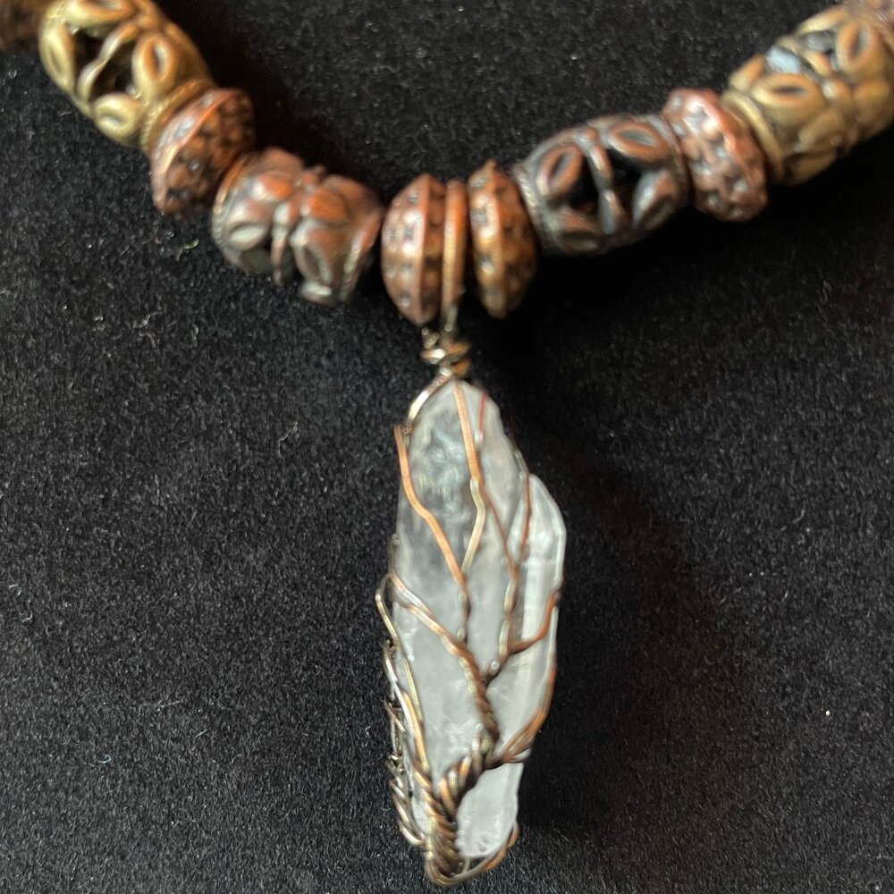Brand new handmade 20" metal beaded necklace with quartz crystal pendant.